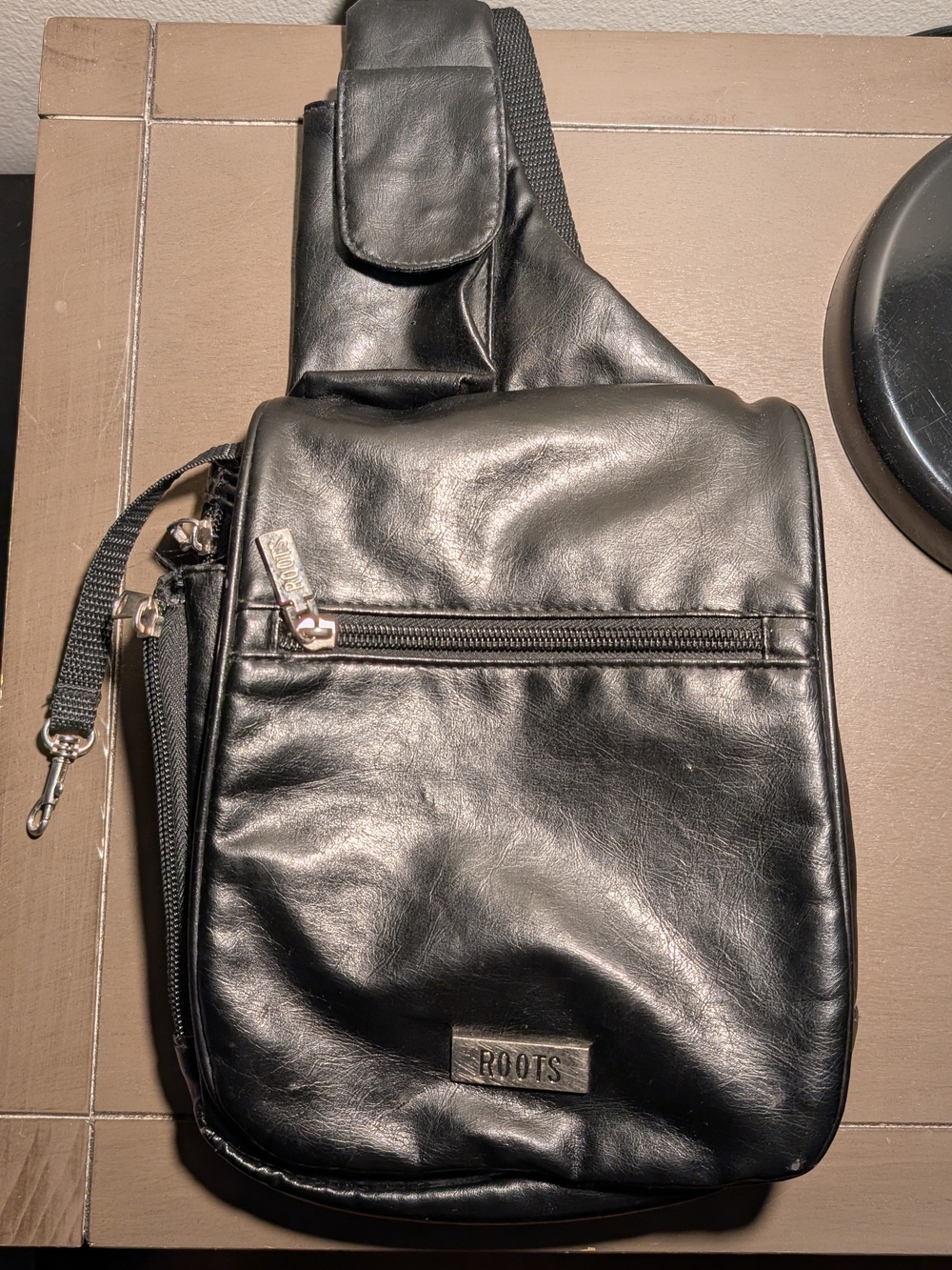 ROOTS Black Leather Crossbody Sling Bag for Men